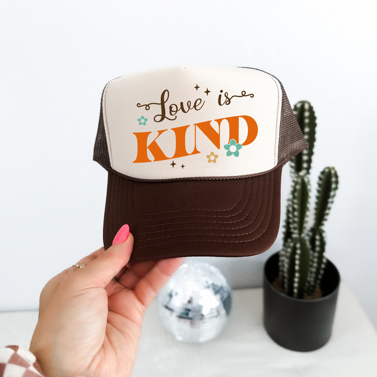 LOVE IS KIND TRUCKER HAT