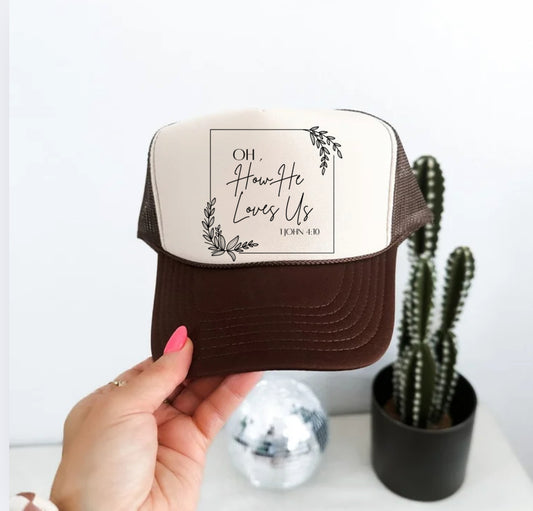HE LOVES US TRUCKER HAT